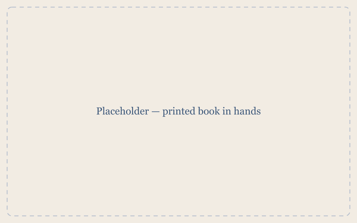 Placeholder — printed book in hands